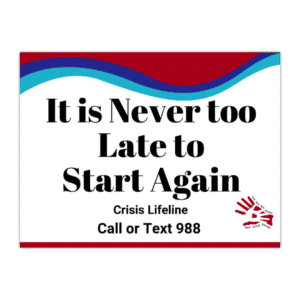 Sign says, “It is Never Too Late to Start Again" along with the crisis lifeline that says, "Call or text 988" with the suicide prevention awareness colors and the Our City Cares Logo at the bottom.